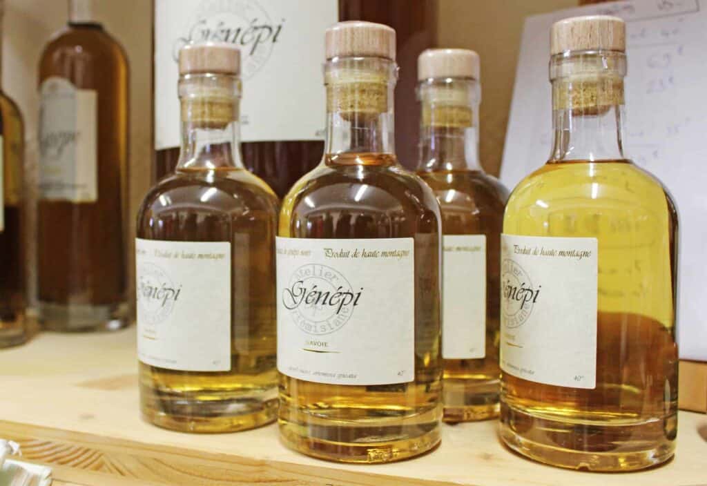 Mixed Genepi bottles on a wooden display shelf