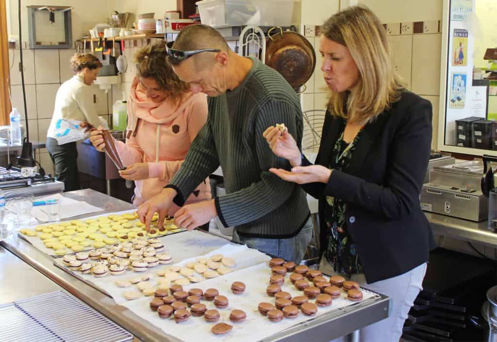 The team assembling and tasting macarons
