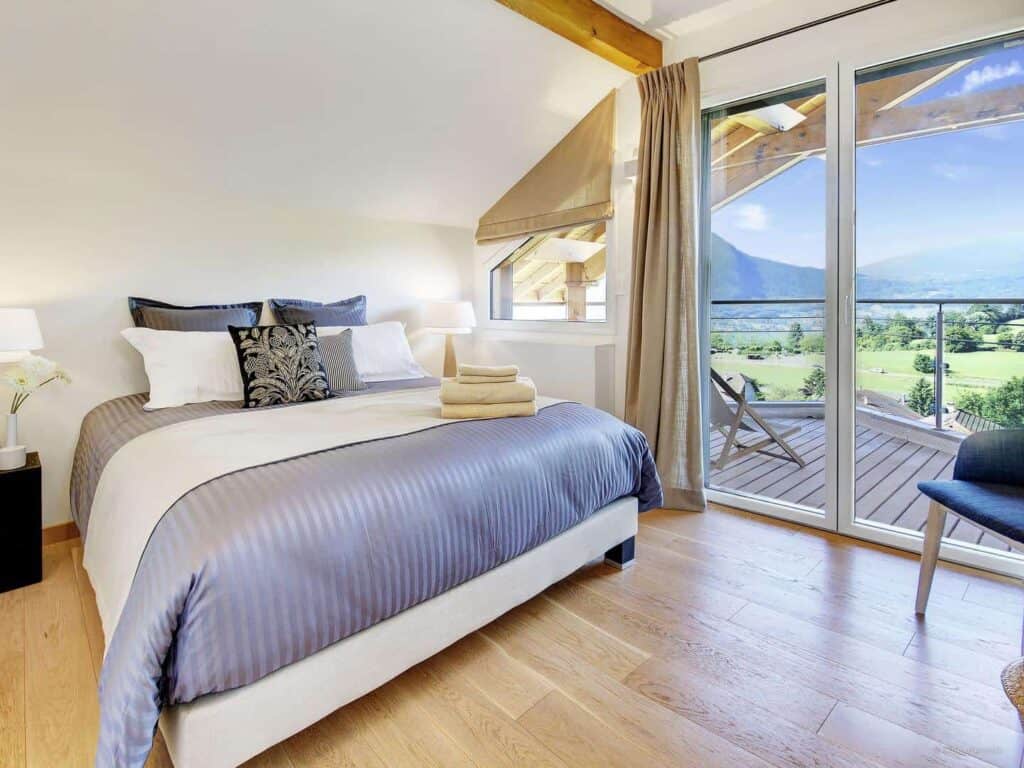 A very bright bedroom in Villa Flying Dragon with private balcony.