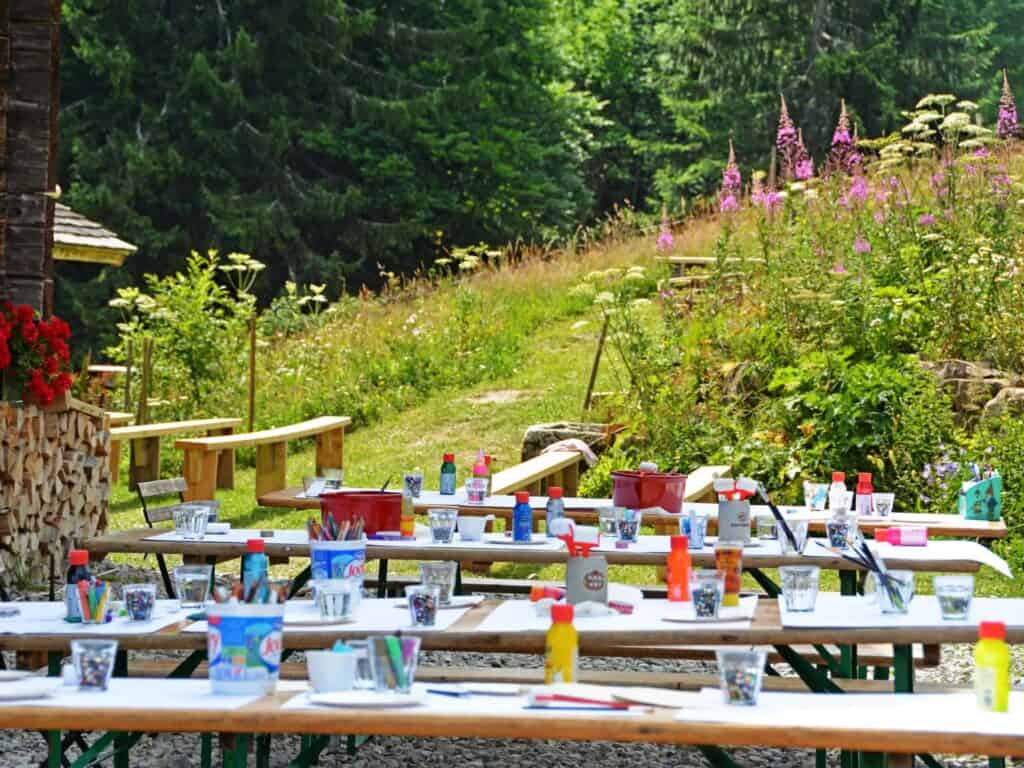 Tables set ready for children to have their lunch at a mountain farm