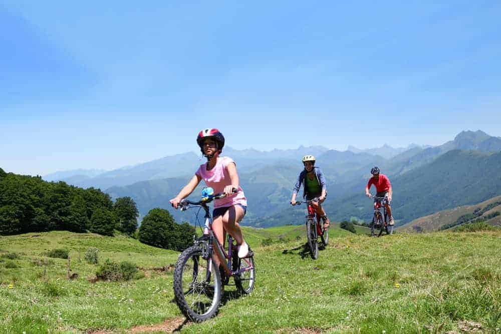 A family riding on the La Clusaz Mountain bike trails