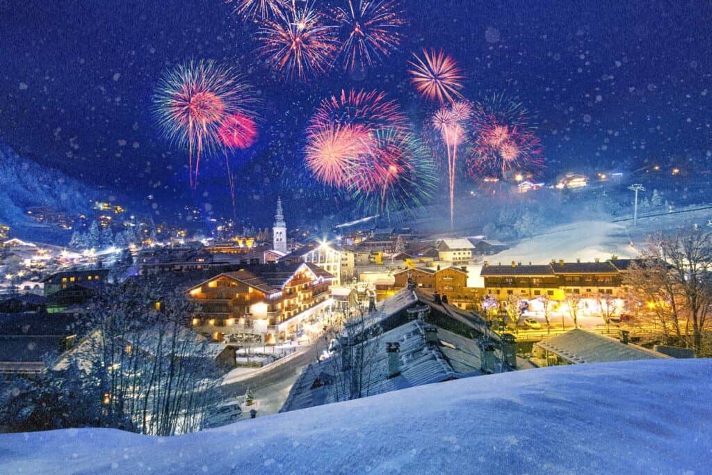 A ski resort village under a sky of fireworks