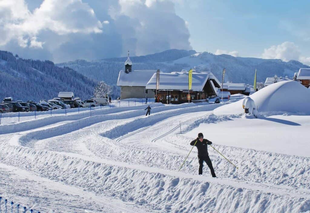 A man cross country skiing in Morzine with mountains views