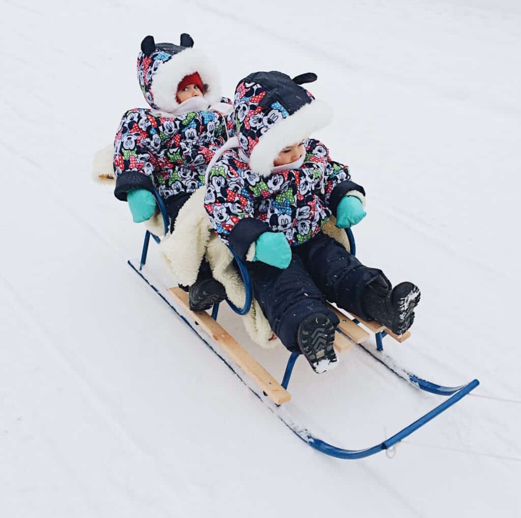 Two oung kids on a sledge