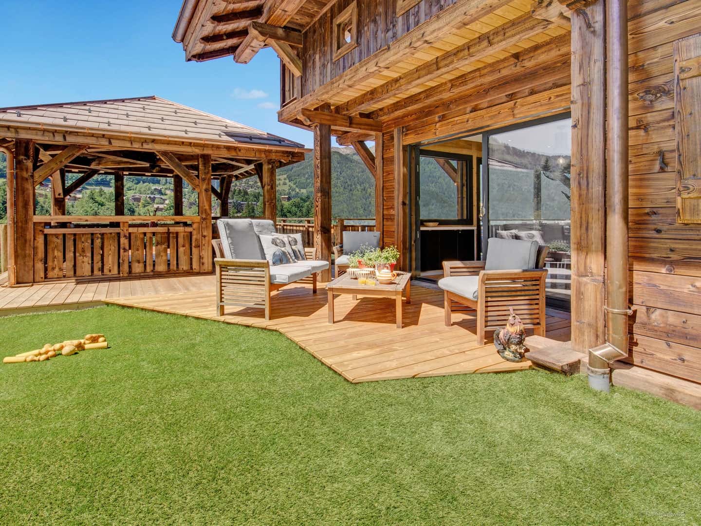 Outdoor dining and lounge areas at Chalet Moutelette