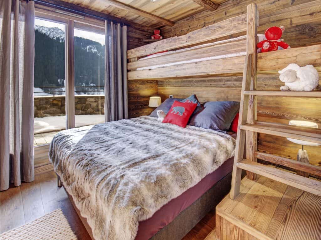 Cool kids' bedrooms: A double bed and a single bed above at Sweet Nest lodge
