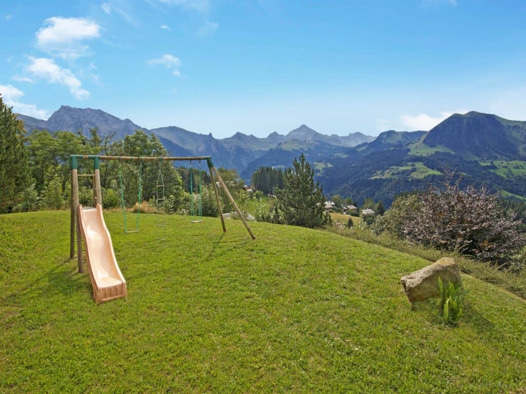 Child friendly ski chalets - the swings and slide at Grange a L'Ours