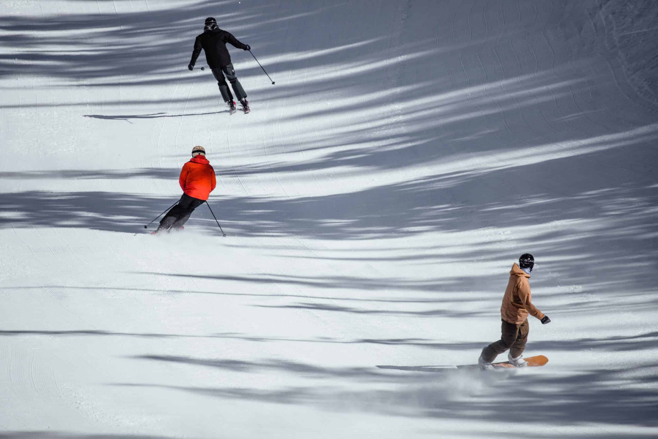 Three people skiing
