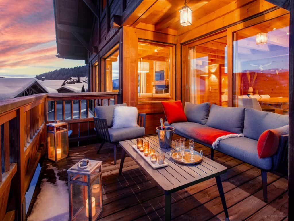 Outdoor seating area at dusk at Chalet Alpachic
