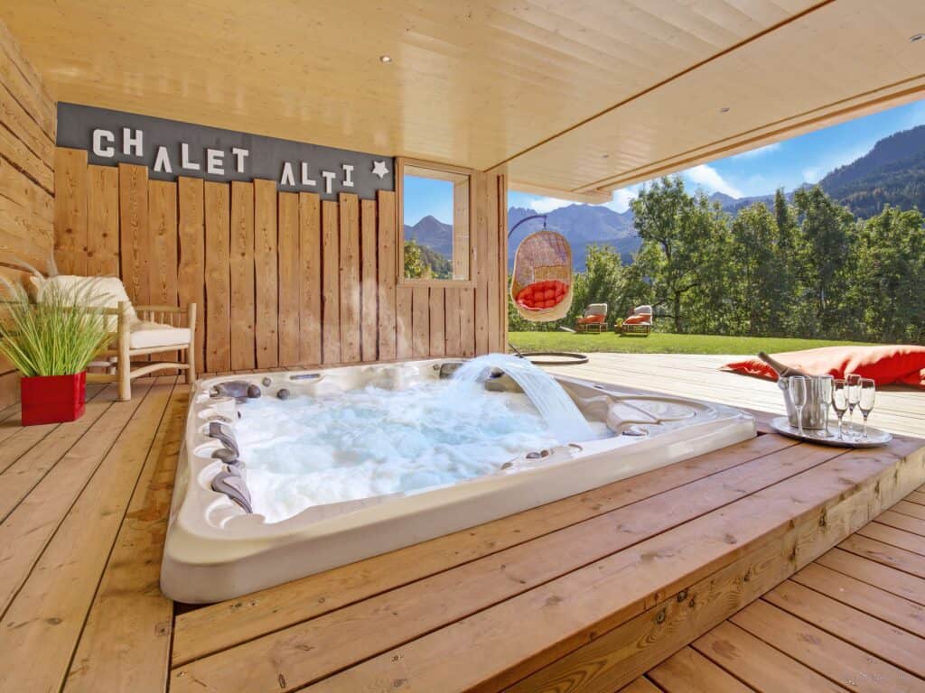 An outdoor hot tub and decking area with Champagne
