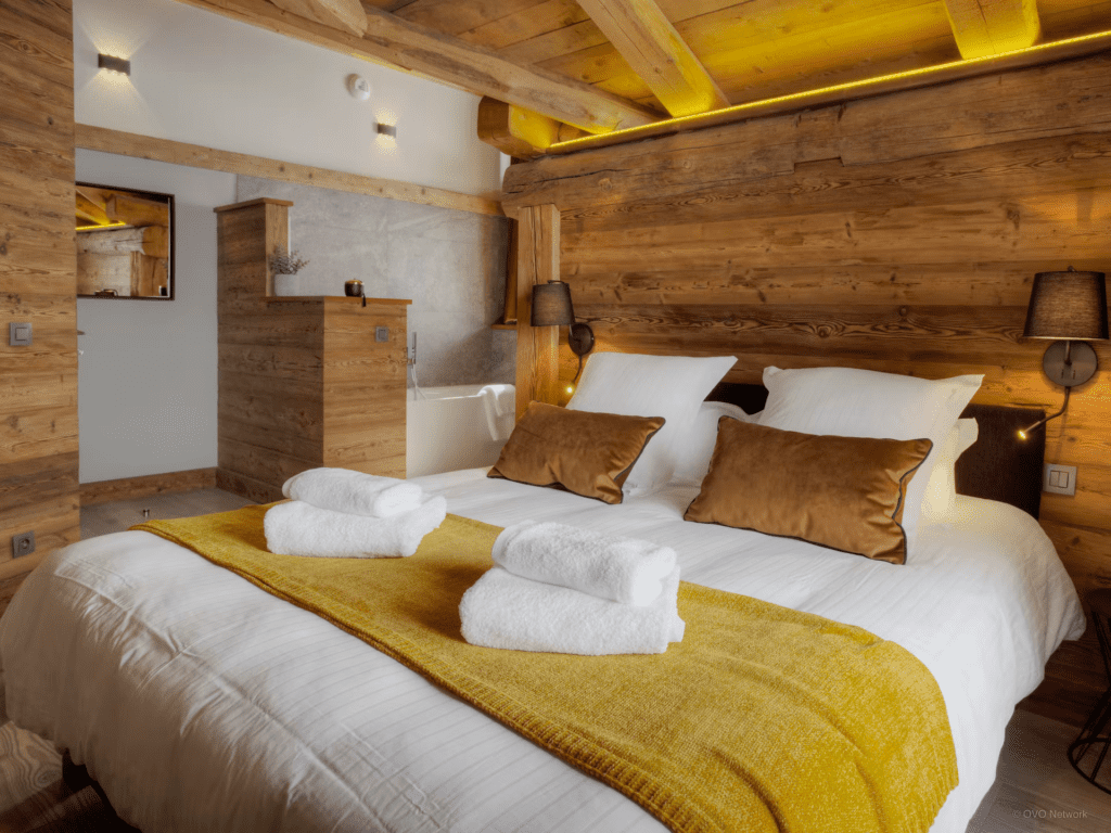 chalet-goville-golden-toned-bedroom-with-bathtub