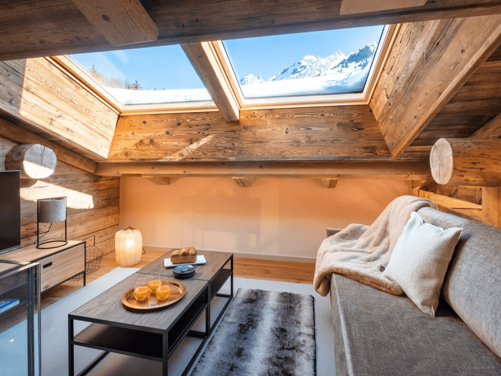 A reading room with skylights and a mountain view.