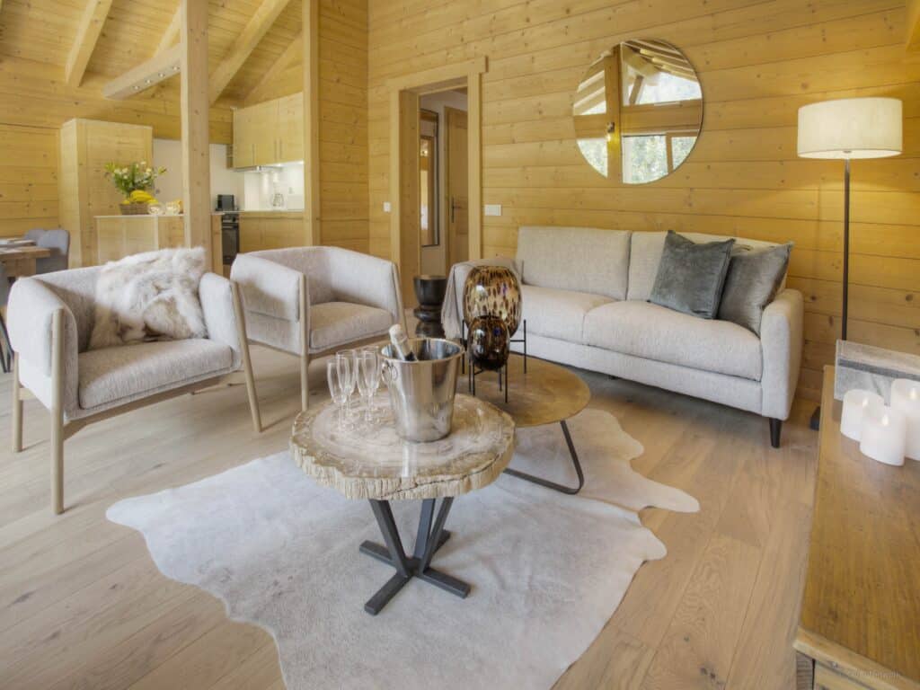 The neutral living space at Dorealp with subtle glass vases as features on the coffee tables.