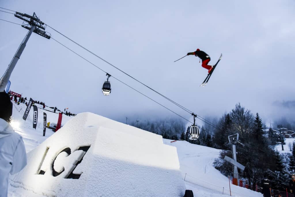 A freestyle skier performing a trick in the park.