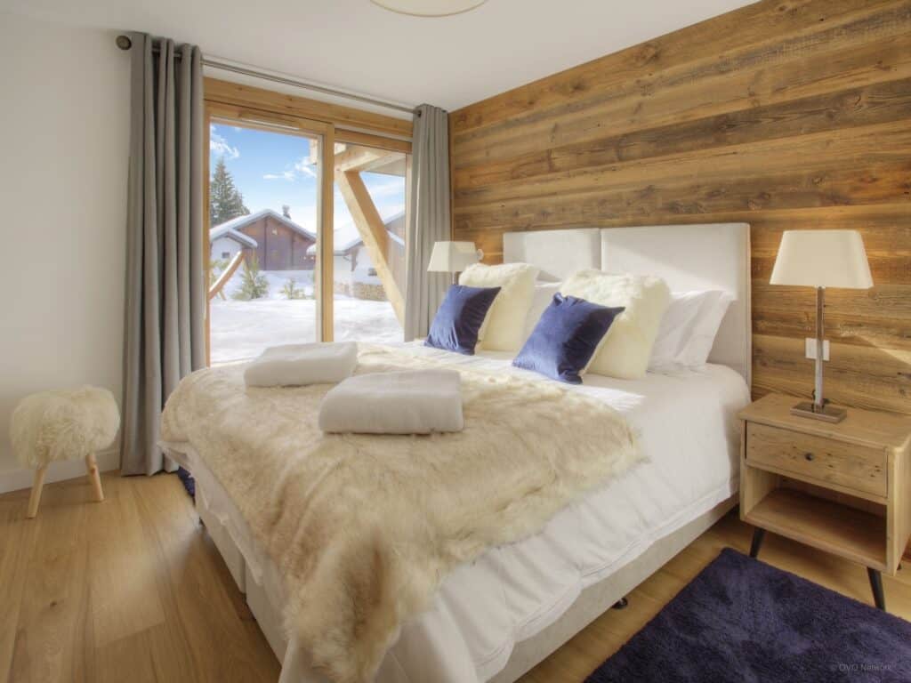 A bedroom at Chalet Behansa, in the Alps
