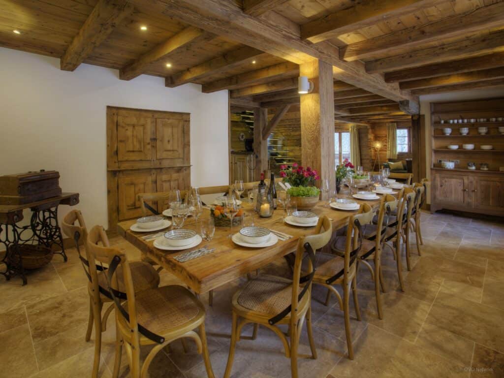 The dining room at Chalet Goville with traditional wooden beams