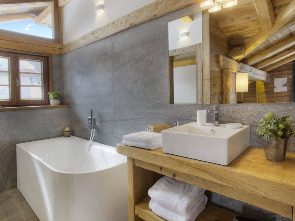 One of the bathrooms at Chalet Goville, planned by an interior designer with large bath tub