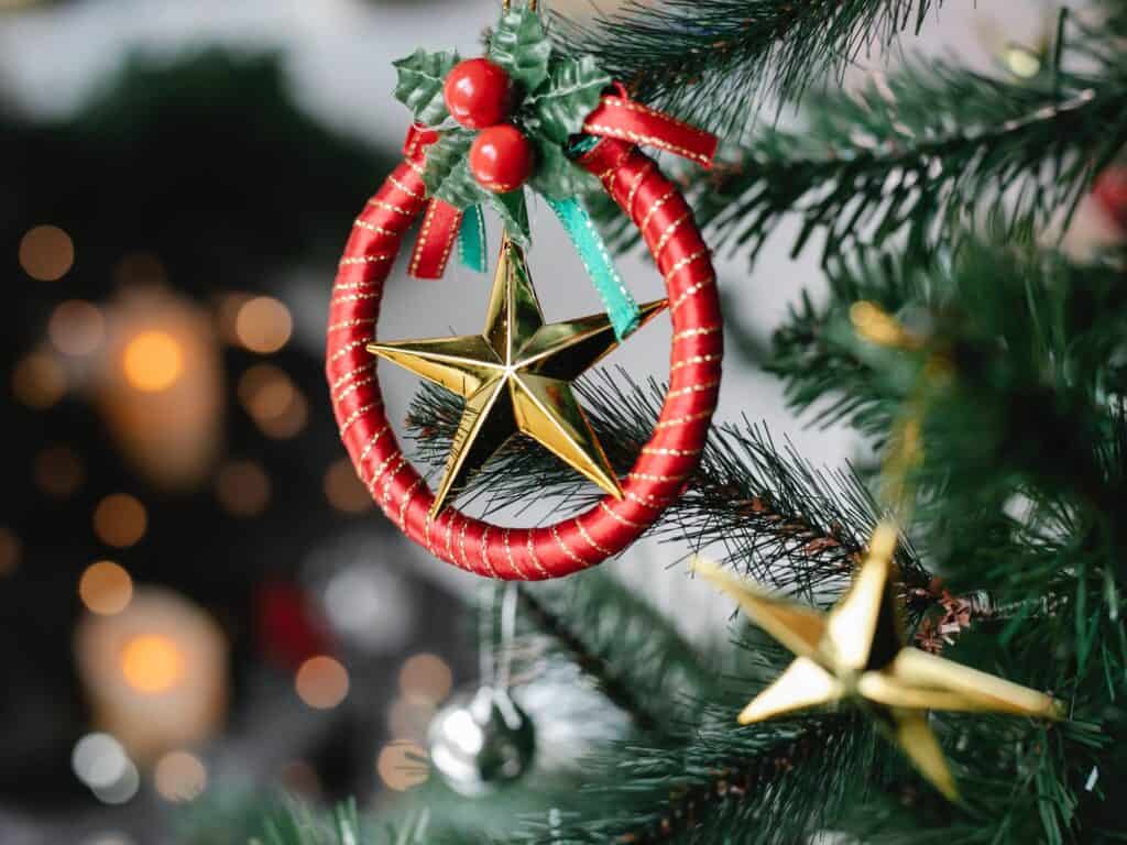 A homemade Christmas tree ornament in traditional red and green