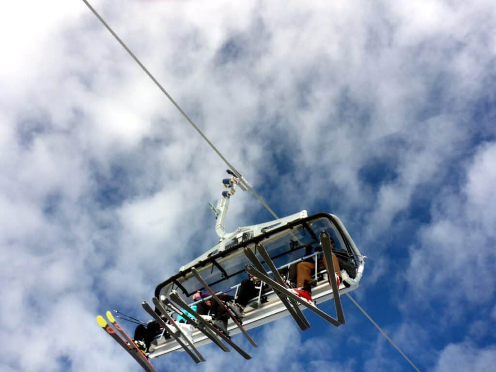Skiers sitting on a chairlift