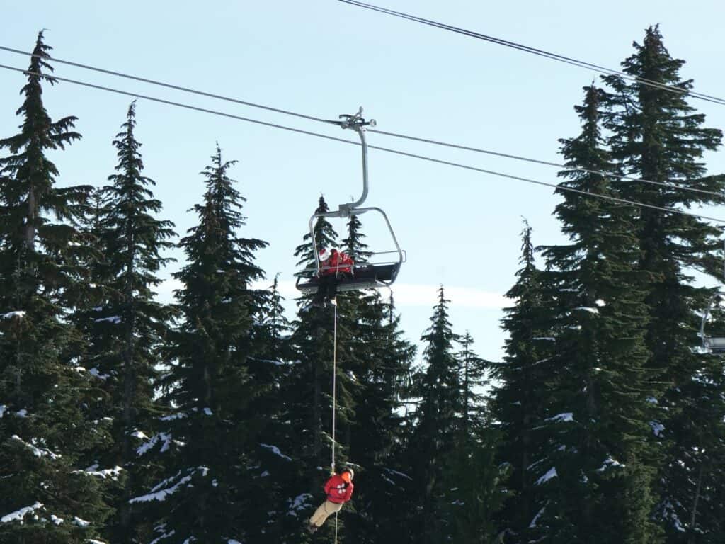 A rescue team attend an emergency on the chairlift 