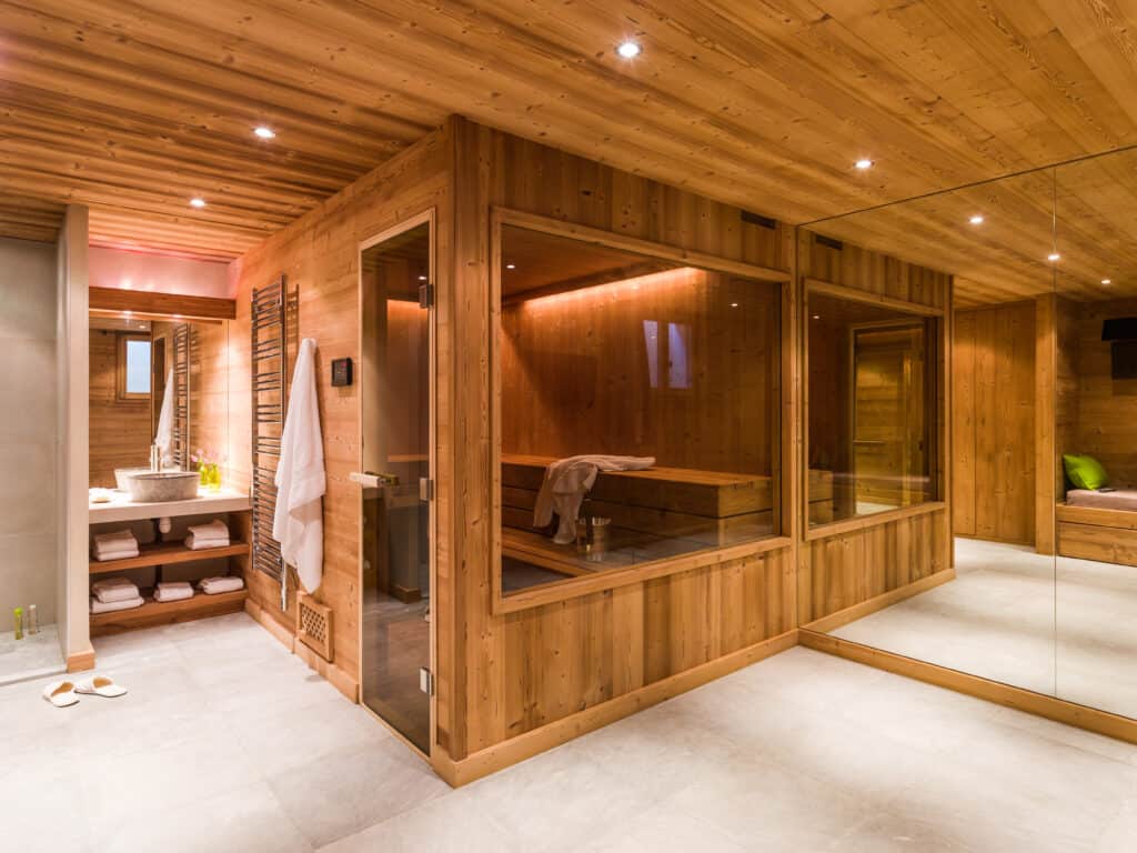 Large wooden sauna with glass doors