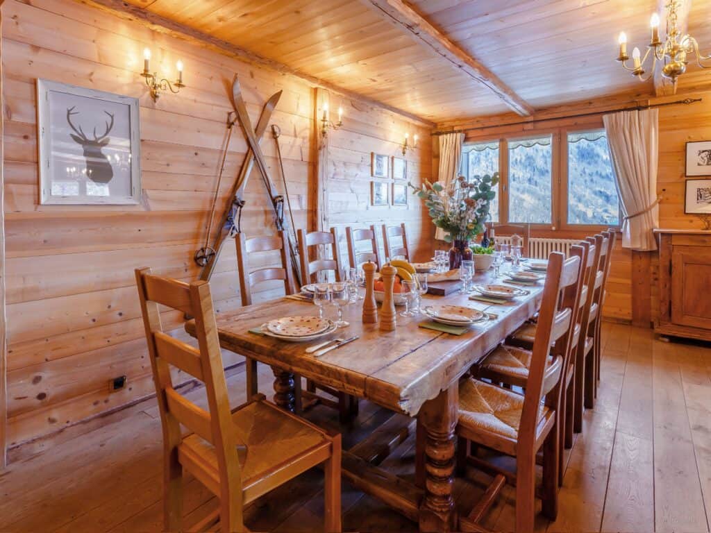 Chalet Guest dining space with vintage skis on wall