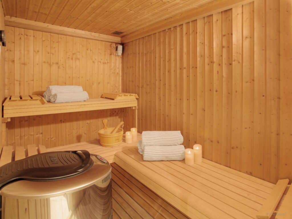 Traditional wooden sauna with bucket and ladle