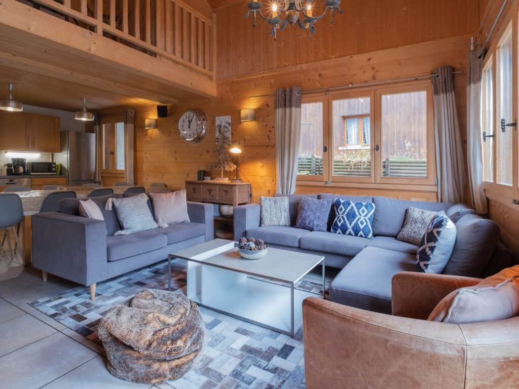 Living room with grey sofas at Chalet Bellanis in Morzine