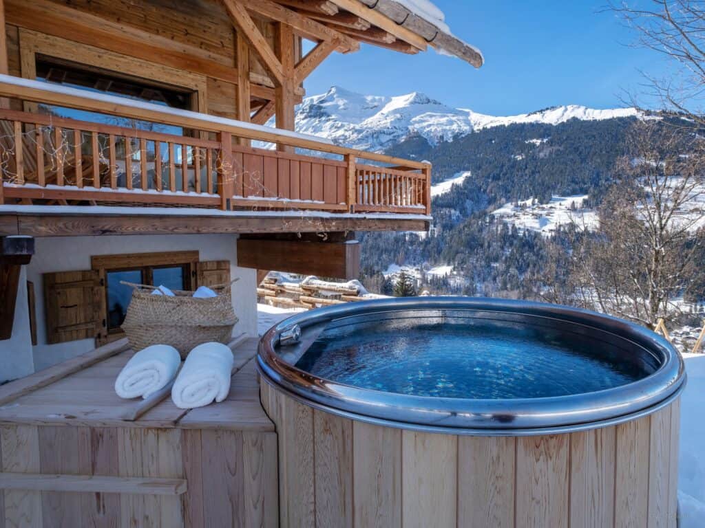 Hot tub looking out onto snowy mountains