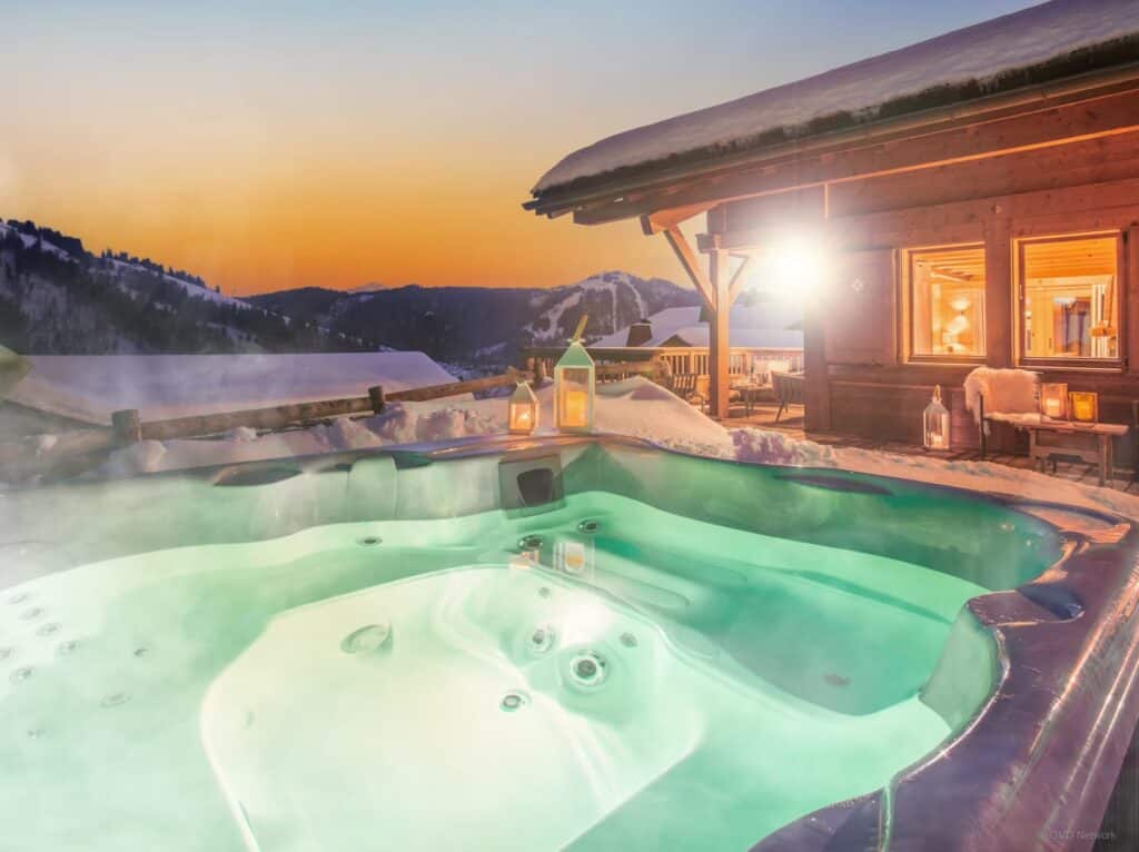 Relax in the hot tub with a mountain view