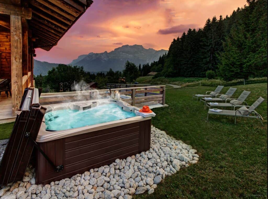 Hot tub with mountain views at dusk