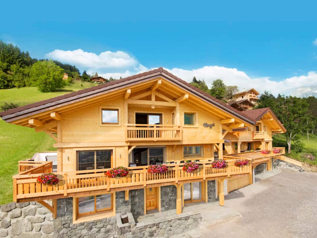 Chalet Nougat - a traditional wooden chalet surrounded by fields