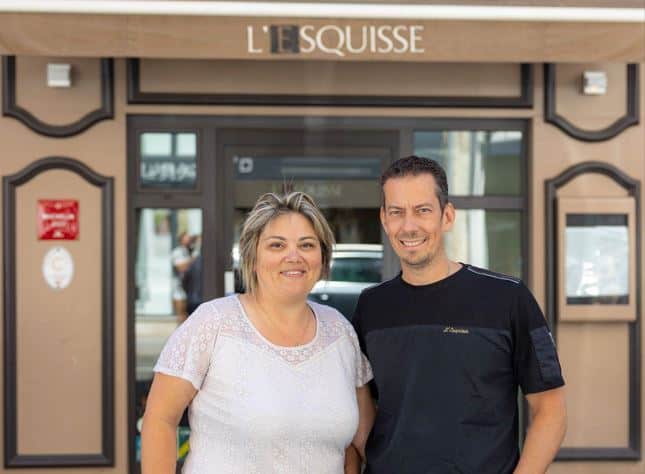 Stéphane Dattrino, chef at L'Esquisse, with his wife in front of the restaurant