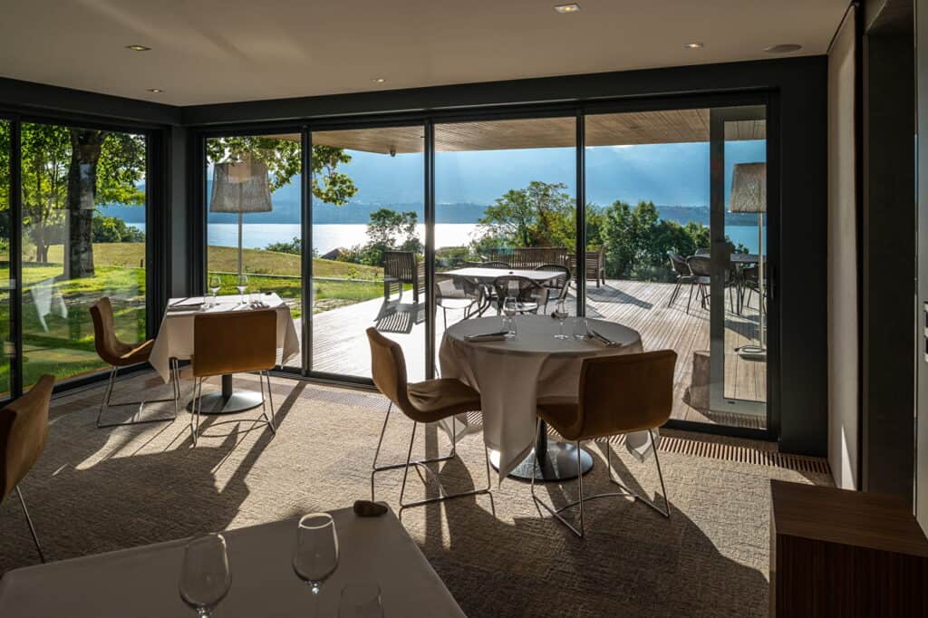 Floor-to-ceiling windows offer diners a wonderful view of the lake