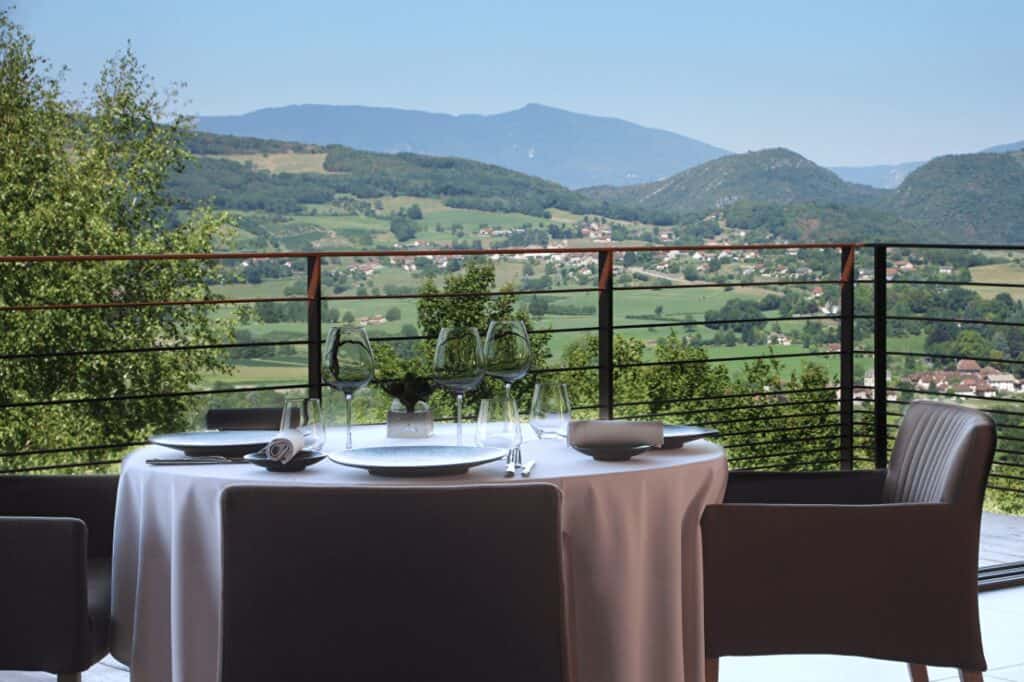The terrace at Les Morainières, in Jongieux, with a view of the mountains