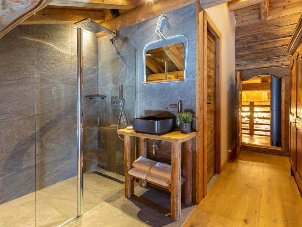 Wood and stone are used in this elegant shower room