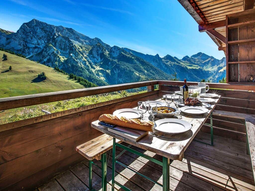 A table set for lunch on the terrace of Chalet Capieu