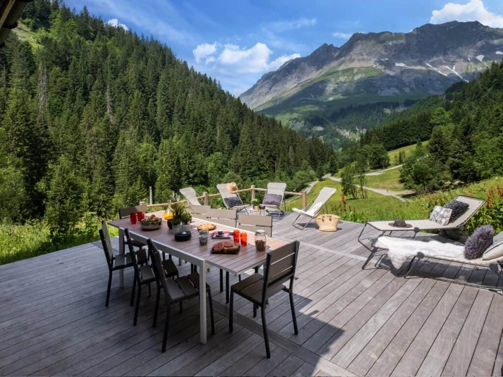 Sunny terrace at Chalet Victorina overlooking the mountain ranges
