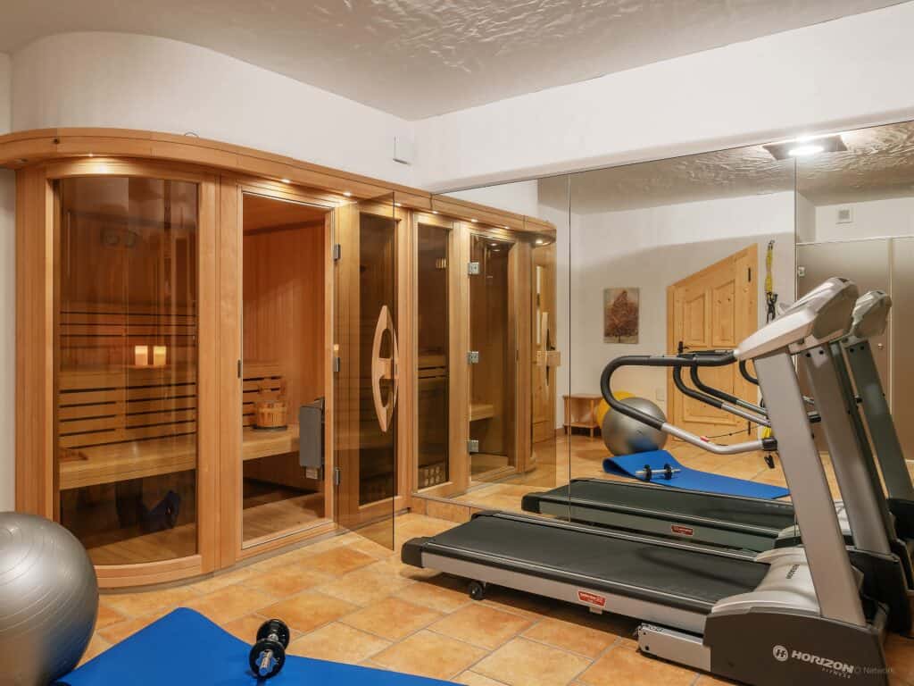 The glazed sauna and the gym at Chalet Cinq Moutons