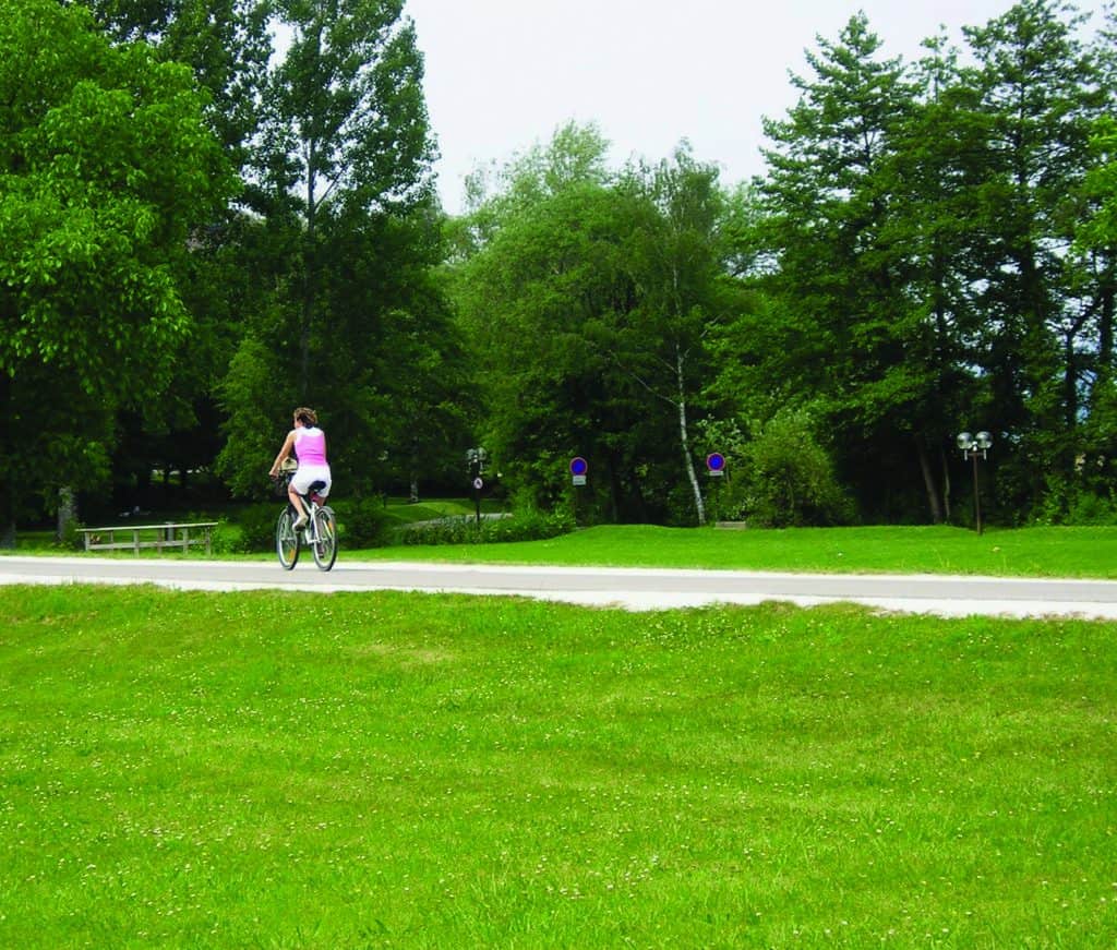 A young woman enjoys a bicycle ride on the Voie Verte