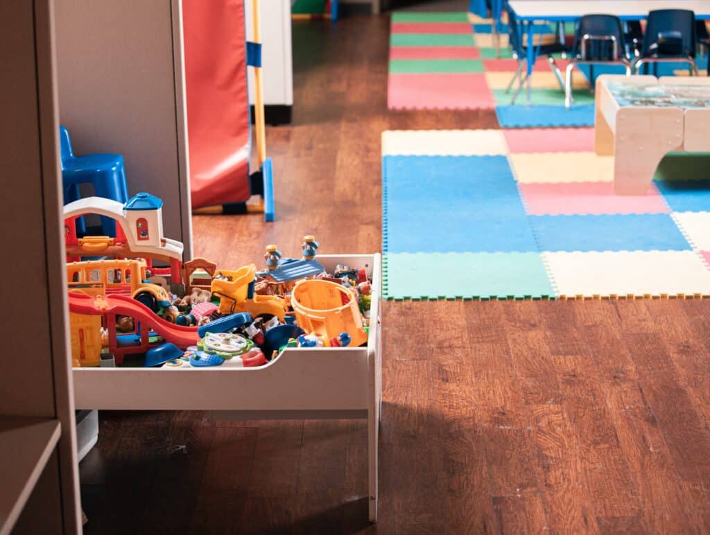A nursery room, with toys, play mats and books