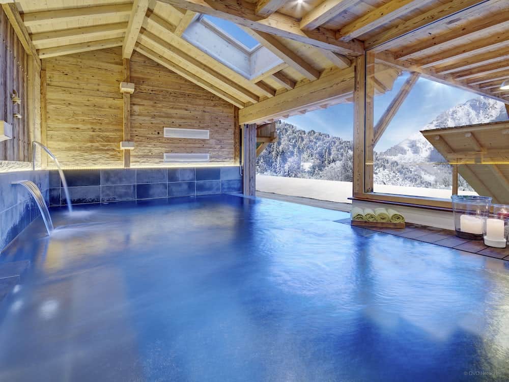 The inside / outside swimming pool at Chalet Ladroit in Manigod