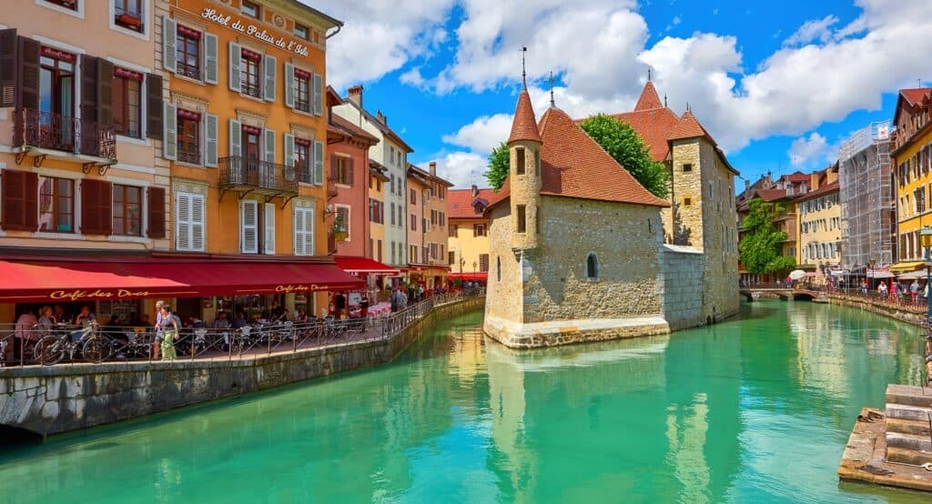 The Palais de l'Isle in Annecy, with canalside restaurants