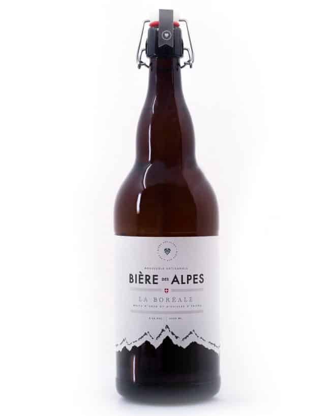 Bottle of beer with a white label reading "bière des Alpes".