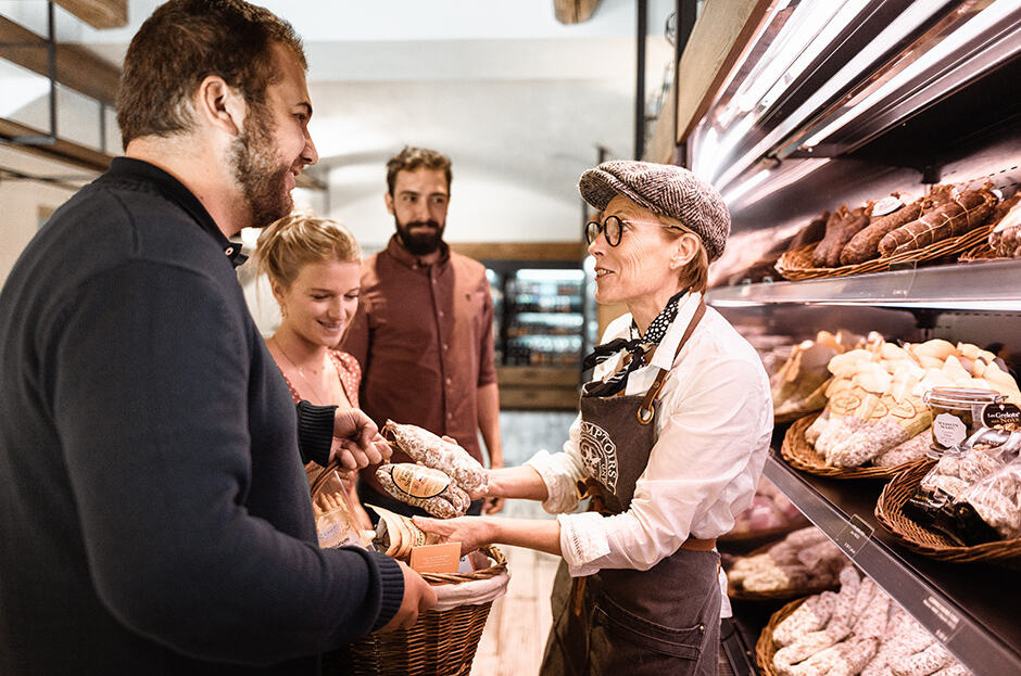 Customers get some advice on the best salami to eat with their raclette
