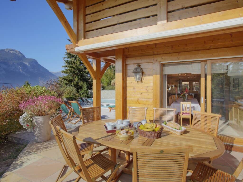 A table laid for breakfast on the terrace at Chalet Beauvoir 12