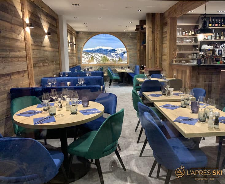 A restaurant with mountain view and blue interiors