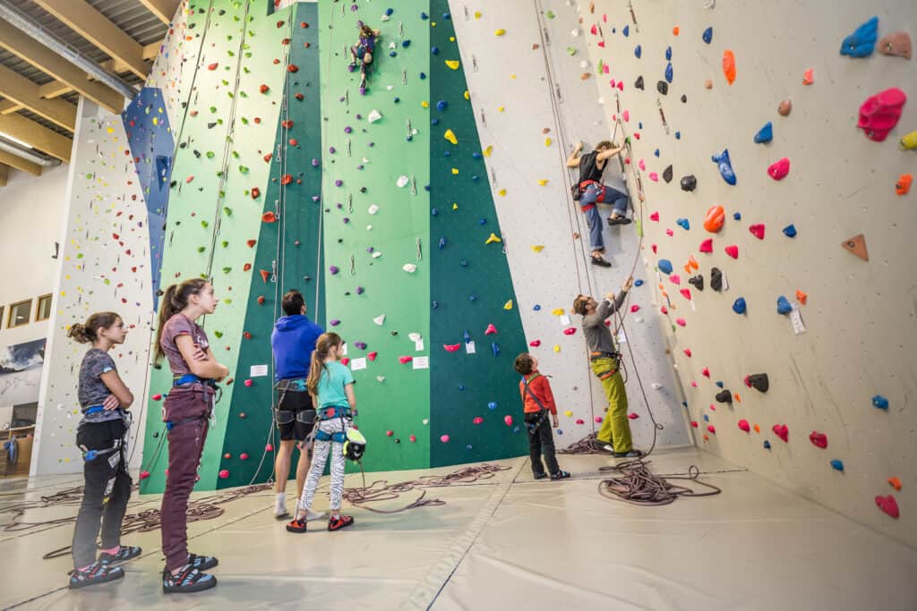 A group of kids try indoor climbing in a centre