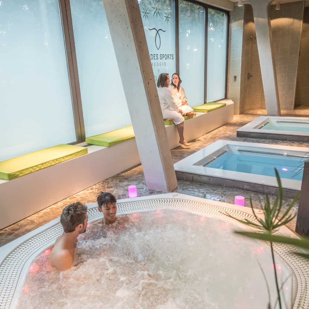 People relax in the jacuzzi at a spa