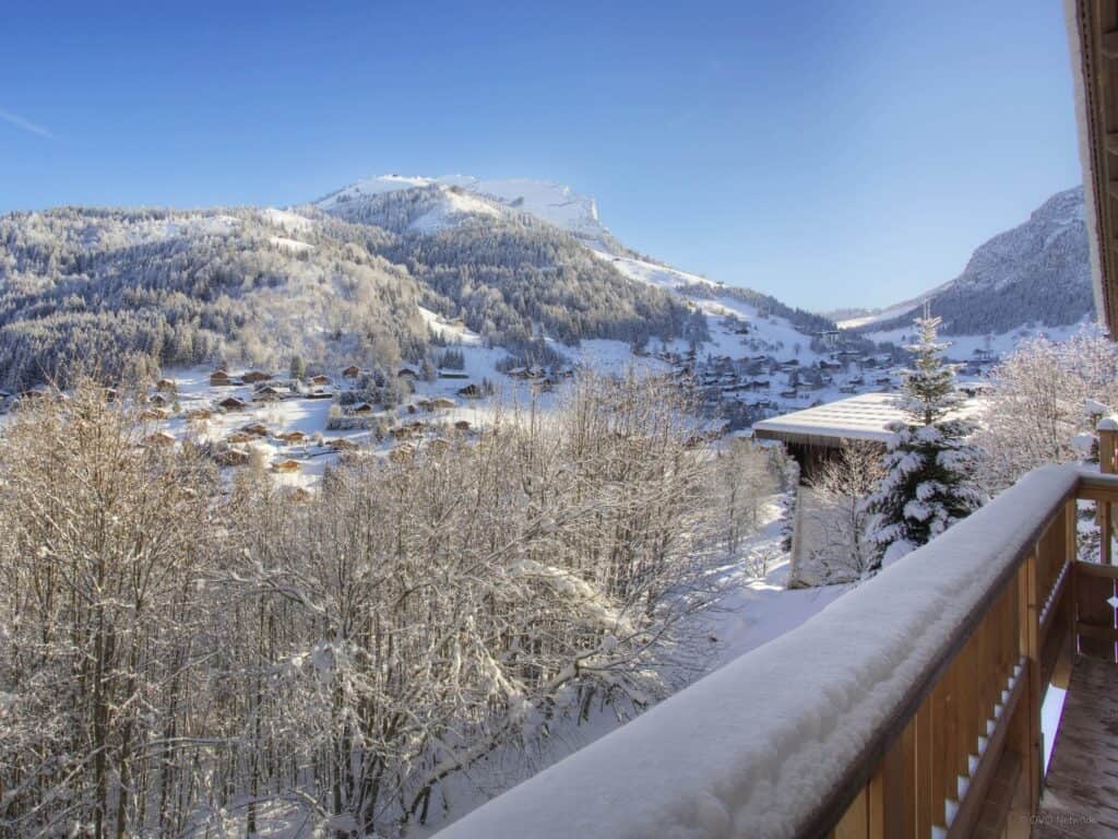 A view of the mountains from the balcony of a chalet